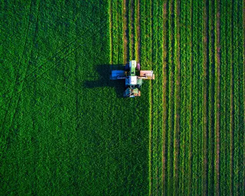 Tractor on green field