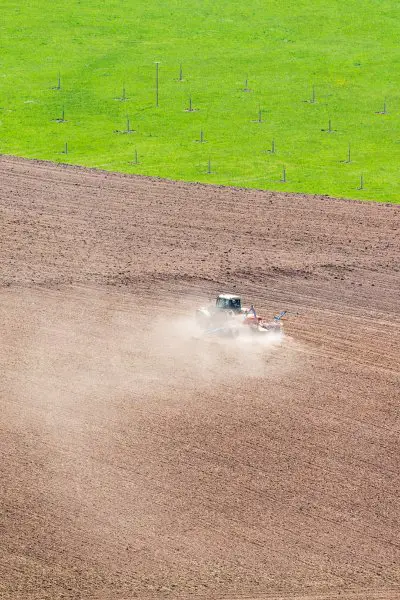 Plowing field in dry conditions